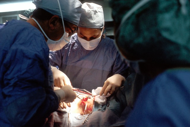 Doctors performing liver surgery in an OR