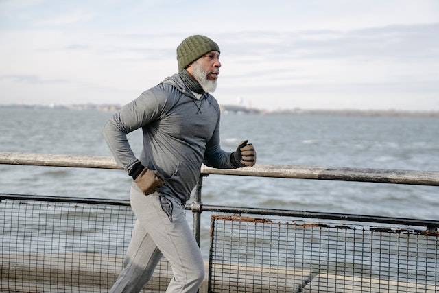 A man staying active by jogging.