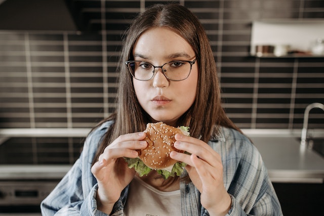 Girl eating a burger