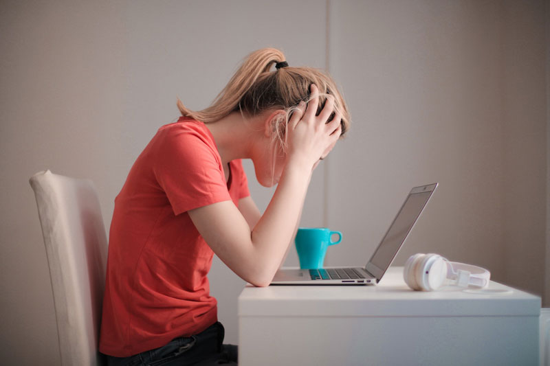 a woman looking stressed while working